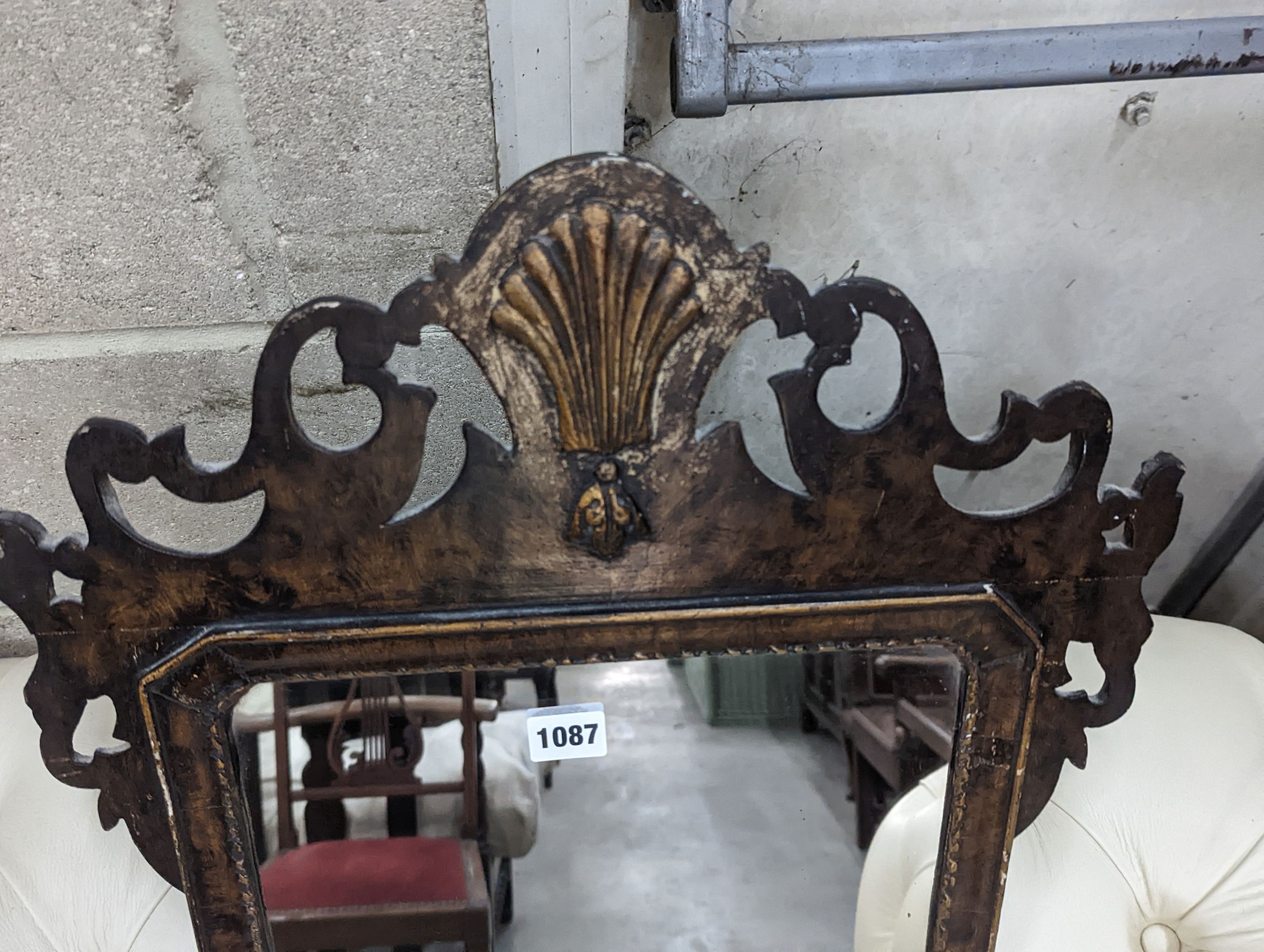 A George II style parcel gilt fret cut wall mirror, width 44cm, height 81cm